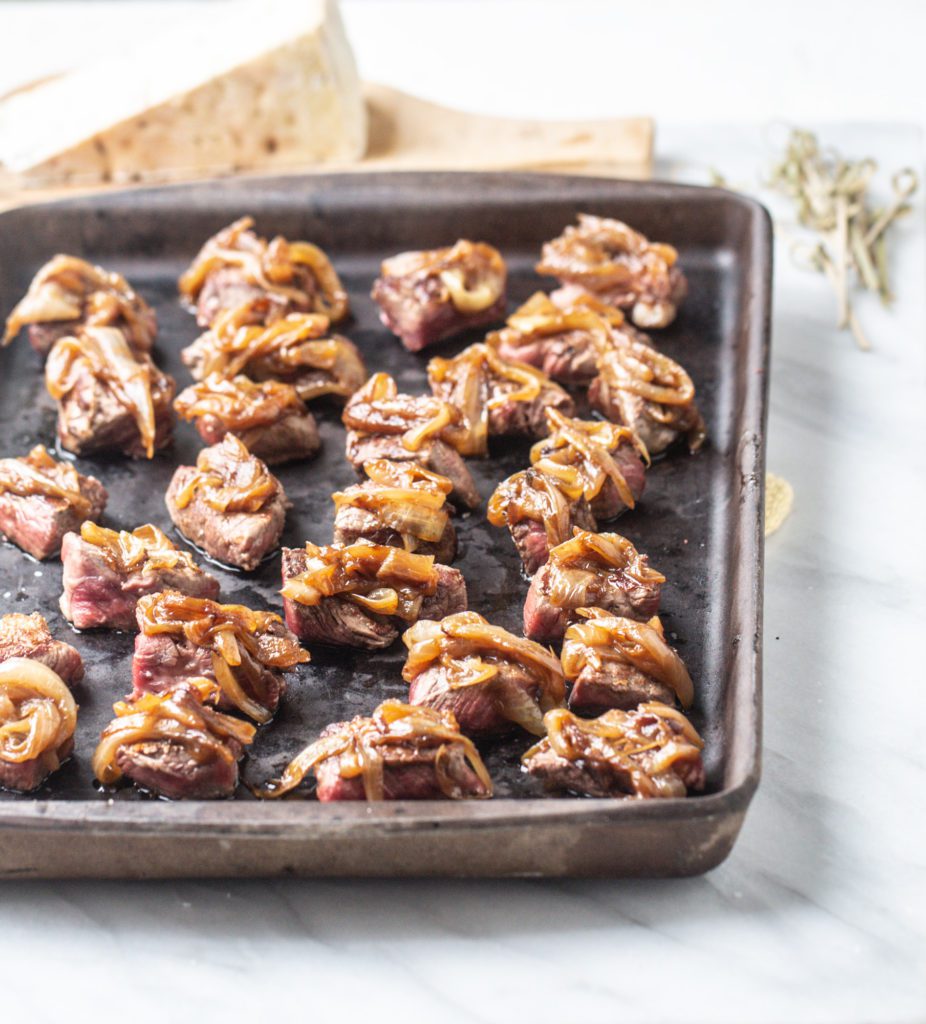 Tenderloin Bites with Blue Cheese and Caramalized Onions TableandDish