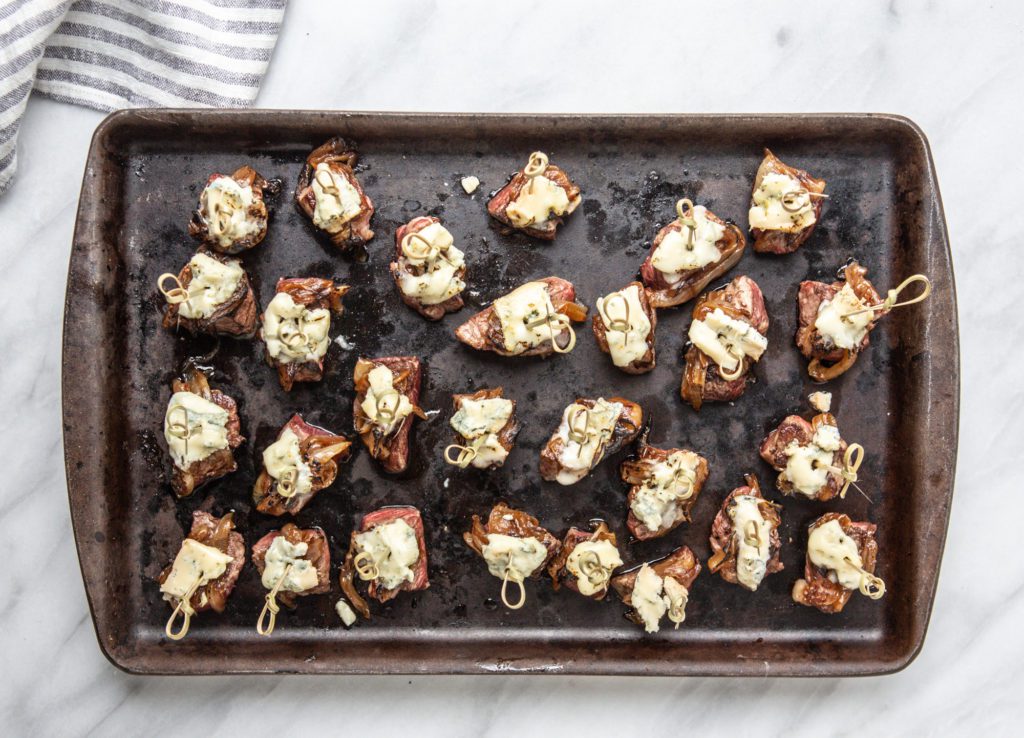 Tenderloin Bites with Blue Cheese and Caramalized Onions TableandDish